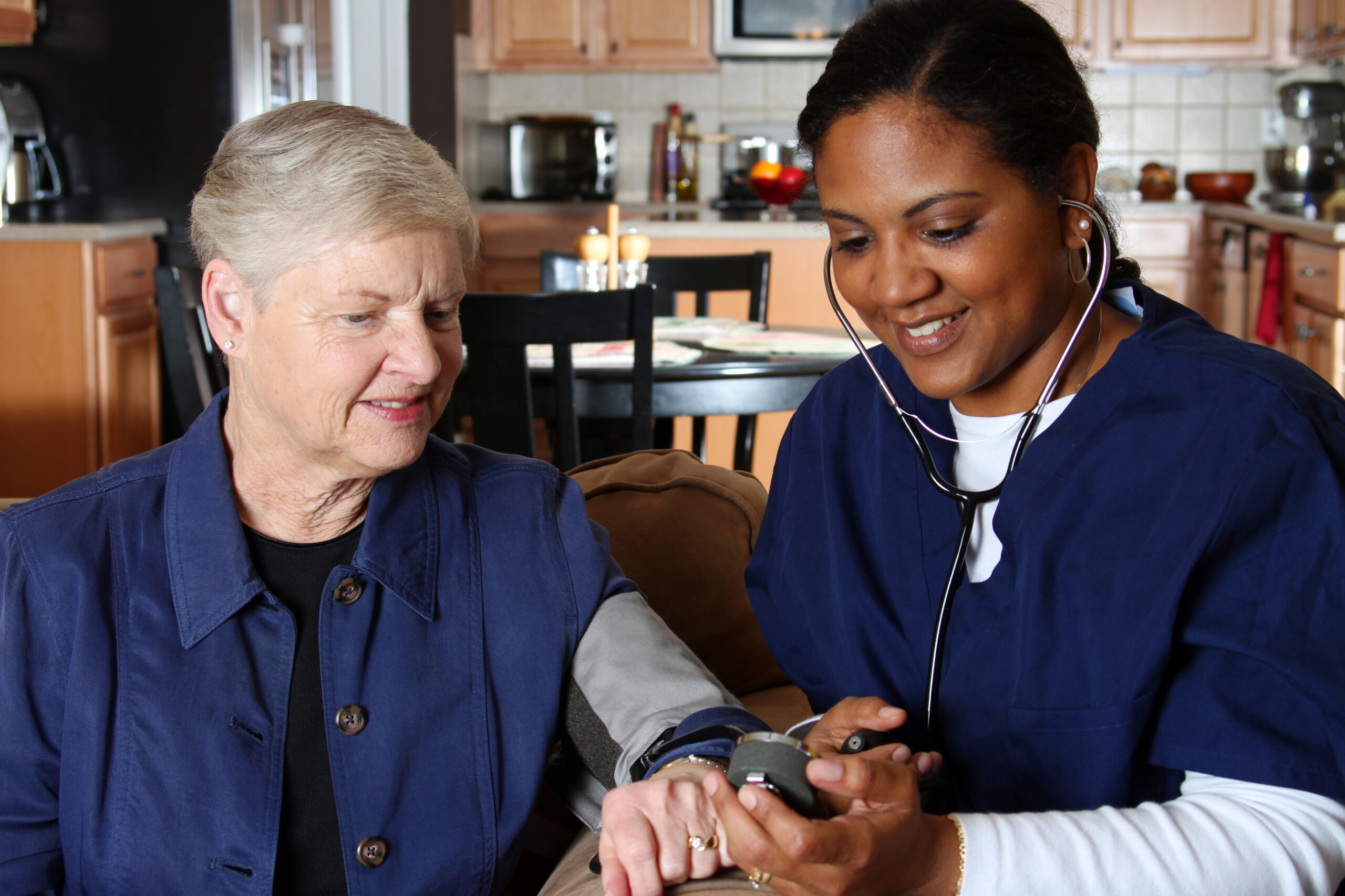 Home health care worker and an elderly couple